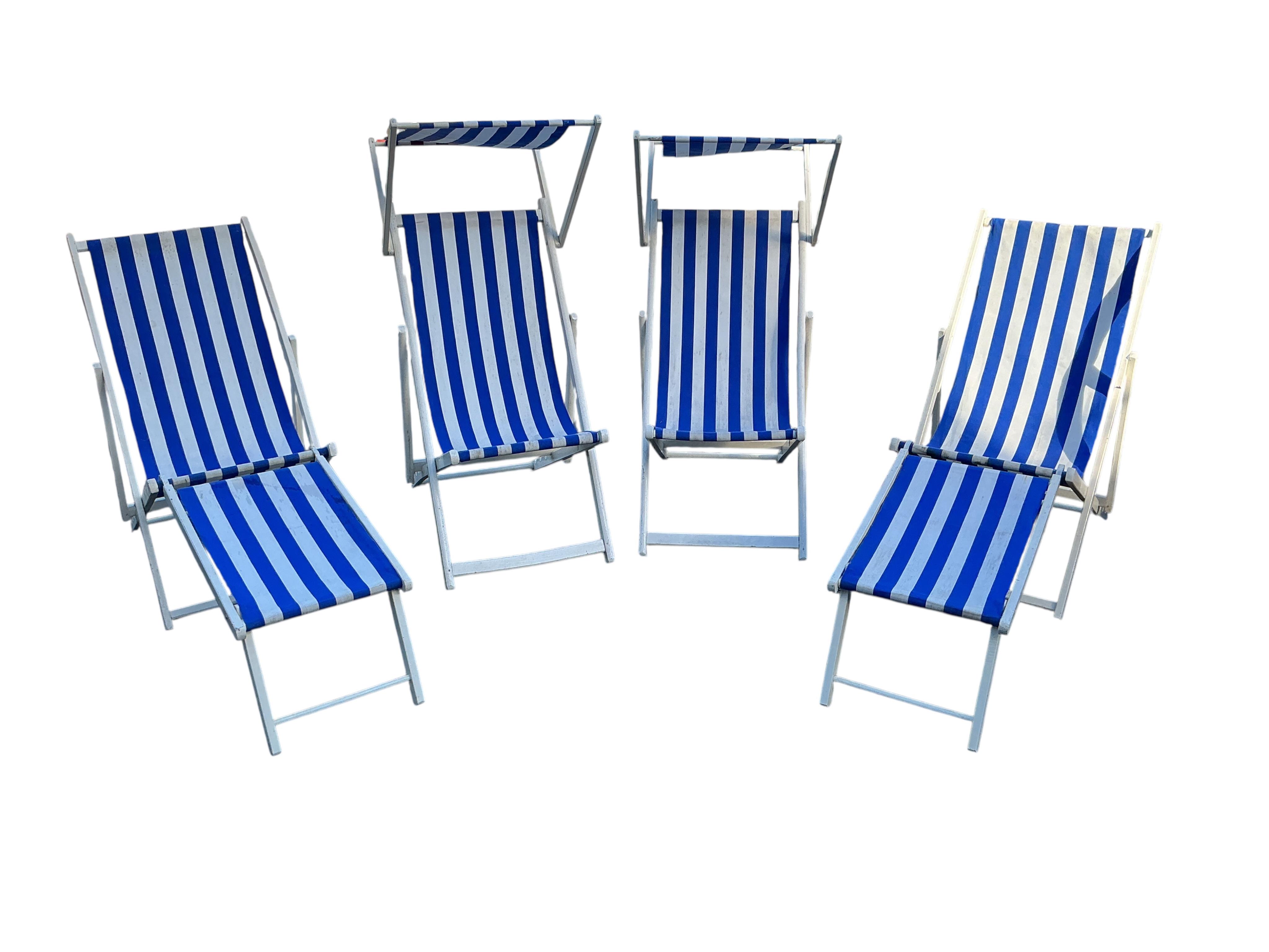 A set of four early 20th century deck chairs, two with footrests and two with sun shades